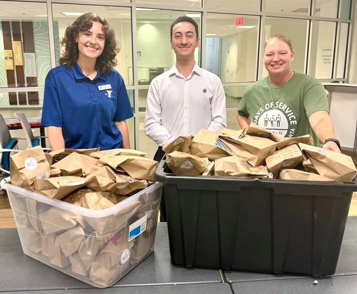 Atlantic Institute volunteers donating snacks for the Ed Isakson/Alpharetta Family YMCA Day of Service in remembrance of September 11