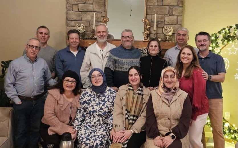 Quran-Torah Conversation Group gathered in a home for Scripture Reasoning and Iftar