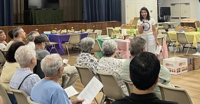 Volunteers packing bagels for a food rescue service project with St. Thomas Aquinas